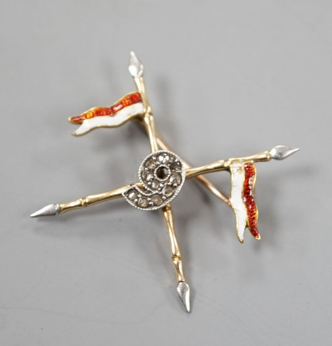 An early 20th century yellow and white metal two colour enamel and diamond chip set 9th Bengal lancers sweethearts brooch, width 29mm, gross weight 3 grams.